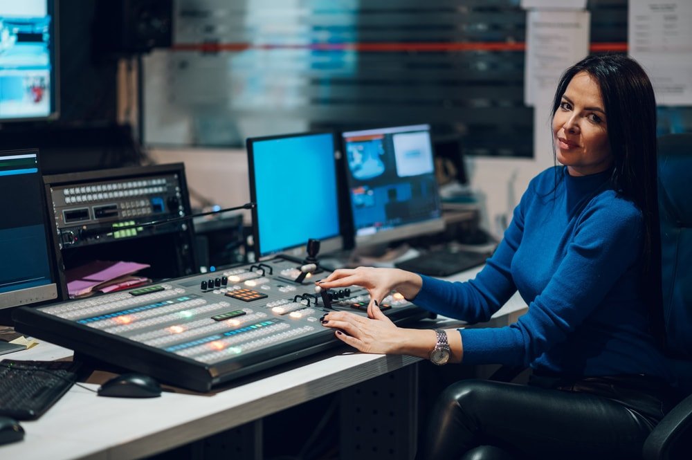 Vision mixer operator at a broadcast gallery desk
